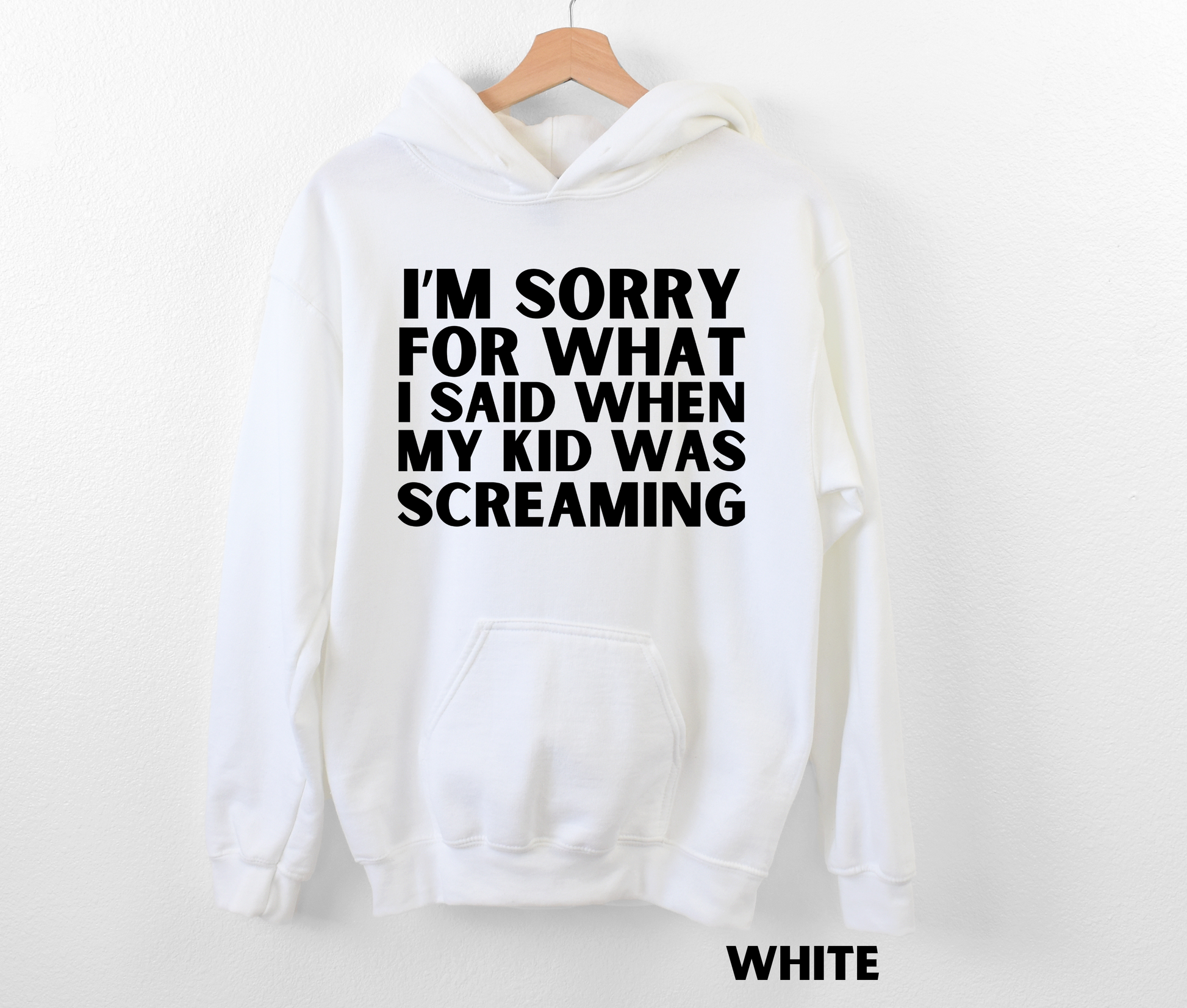 White funny mom hoodie with the text "I'm sorry for what I said when my kid was screaming" in black.