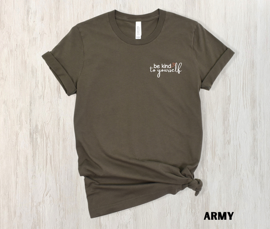 Army colored t-shirt with "be kind to yourself" embroidered in white with a pink heart on the left chest.